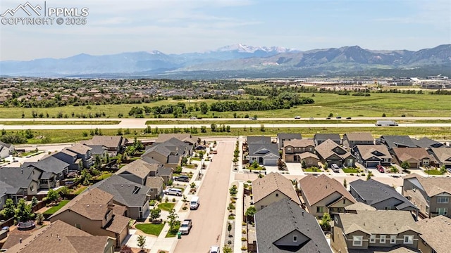 2997 Bright Moon Dr, Colorado Springs, CO 80908 - aerial perspective of suburban area featuring a mountainous background