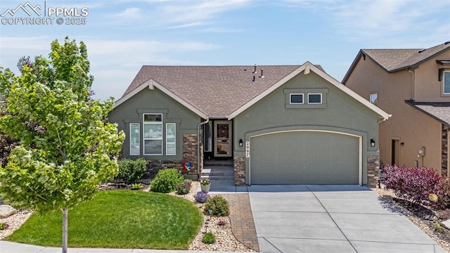 2997 Bright Moon Dr, Colorado Springs, CO 80908 - view of front of house featuring stucco siding, concrete driveway, stone siding, an attached garage, and roof with shingles