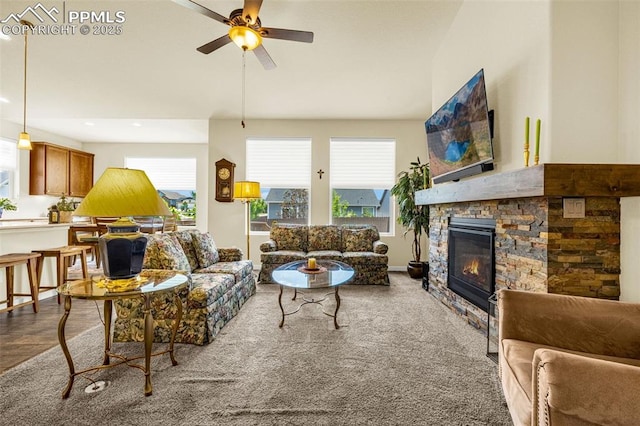 2997 Bright Moon Dr, Colorado Springs, CO 80908 - living room with ceiling fan, a stone fireplace, and recessed lighting