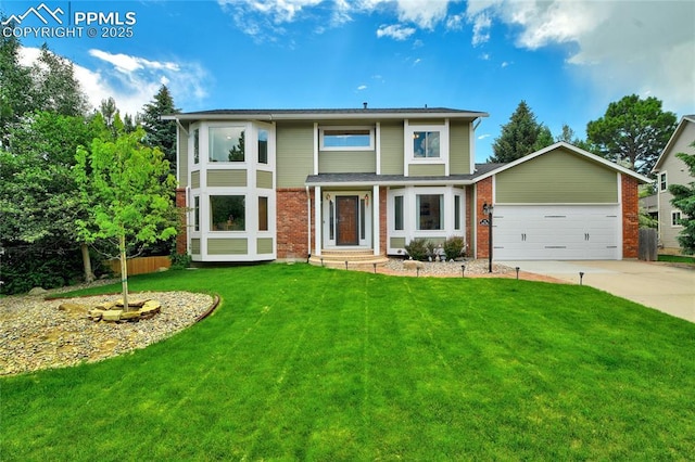 35 Lowick Dr, Colorado Springs, CO 80906 - view of front of property with an attached garage, concrete driveway, a front lawn, and brick siding