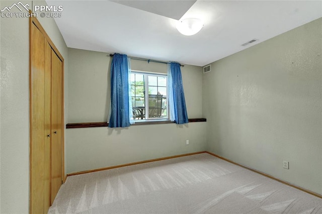 35 Lowick Dr, Colorado Springs, CO 80906 - unfurnished bedroom featuring light carpet and a closet
