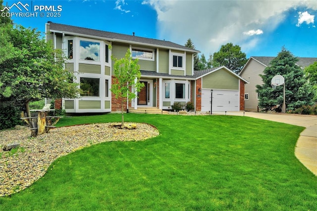 35 Lowick Dr, Colorado Springs, CO 80906 - view of front of house featuring driveway, a front lawn, and an attached garage