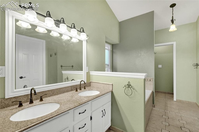 35 Lowick Dr, Colorado Springs, CO 80906 - bathroom with double vanity, a garden tub, tile patterned floors, and vaulted ceiling