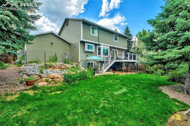 35 Lowick Dr, Colorado Springs, CO 80906 - rear view of house featuring a deck, stairs, and a patio area