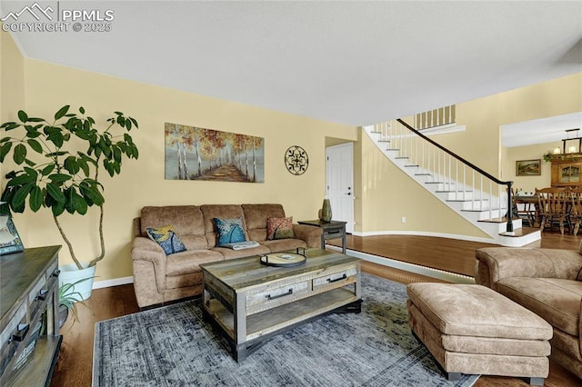 35 Lowick Dr, Colorado Springs, CO 80906 - living room featuring wood finished floors, stairway, and a chandelier