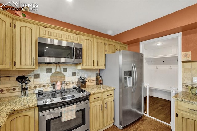 35 Lowick Dr, Colorado Springs, CO 80906 - kitchen with stainless steel appliances, dark wood-style flooring, backsplash, and light brown cabinets