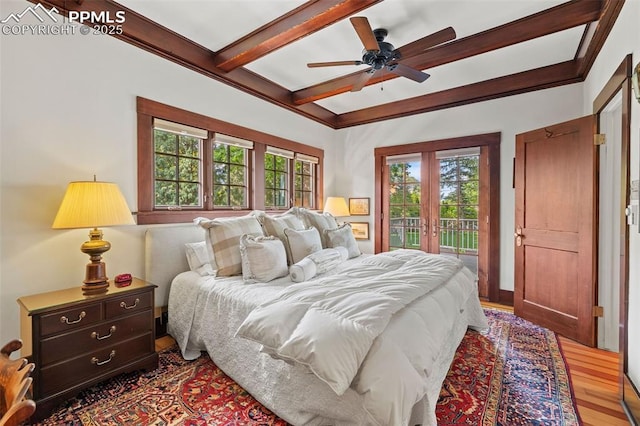 13 2nd St, Colorado Springs, CO 80906 - bedroom with multiple windows, access to exterior, beamed ceiling, wood finished floors, and a ceiling fan