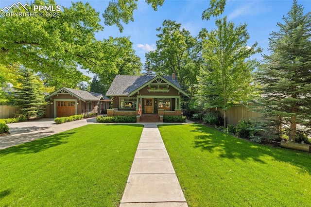 13 2nd St, Colorado Springs, CO 80906 - view of front of home with concrete driveway, a chimney, and covered porch