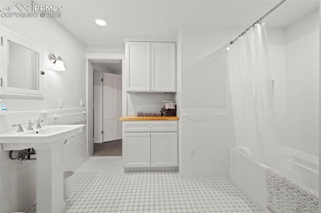 13 2nd St, Colorado Springs, CO 80906 - full bath with shower / tub combo, tile walls, wainscoting, and recessed lighting