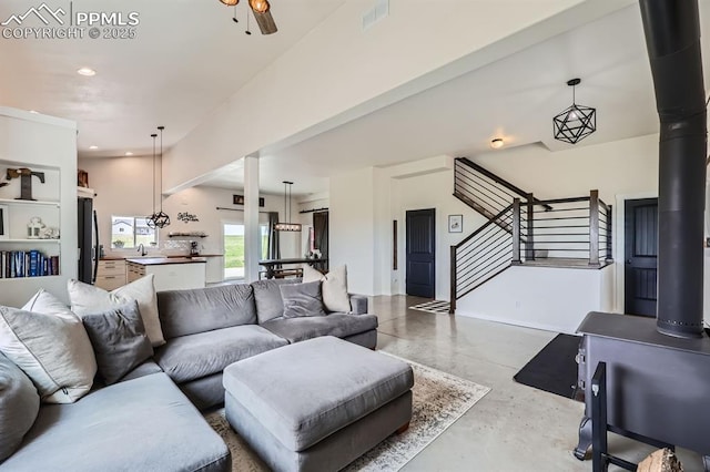 6925 Ht Ranch Trl, Colorado Springs, CO 80908 - living room featuring concrete flooring, stairway, and recessed lighting