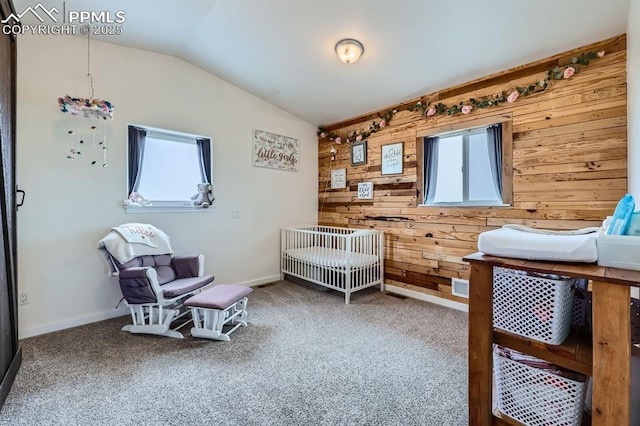 6925 Ht Ranch Trl, Colorado Springs, CO 80908 - carpeted bedroom with multiple windows, wooden walls, and lofted ceiling