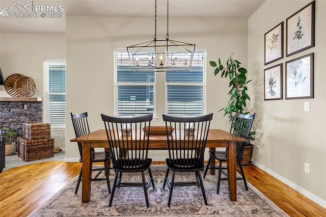 4187 Notch Trl, Colorado Springs, CO 80924 - dining area featuring wood finished floors and a chandelier