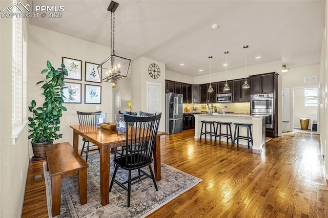 4187 Notch Trl, Colorado Springs, CO 80924 - dining area featuring wood finished floors and a chandelier