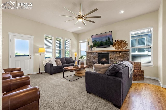 4187 Notch Trl, Colorado Springs, CO 80924 - living room with a ceiling fan, a stone fireplace, and recessed lighting