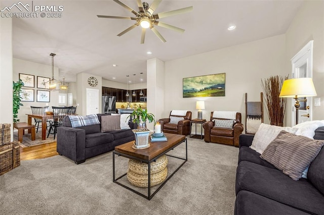 4187 Notch Trl, Colorado Springs, CO 80924 - living area featuring light colored carpet, a ceiling fan, recessed lighting, and a chandelier