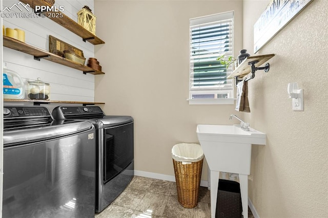 4187 Notch Trl, Colorado Springs, CO 80924 - laundry area featuring washer and clothes dryer and light tile patterned floors