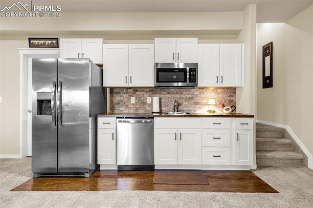 4187 Notch Trl, Colorado Springs, CO 80924 - kitchen featuring stainless steel appliances, white cabinets, and backsplash