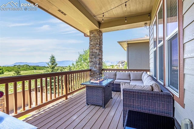 4187 Notch Trl, Colorado Springs, CO 80924 - deck featuring an outdoor living space and a mountain view