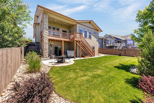 4187 Notch Trl, Colorado Springs, CO 80924 - back of house with stairway, a fenced backyard, a deck, and a patio