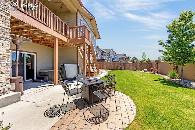 4187 Notch Trl, Colorado Springs, CO 80924 - fenced backyard featuring a fire pit, a hot tub, stairs, and a patio area