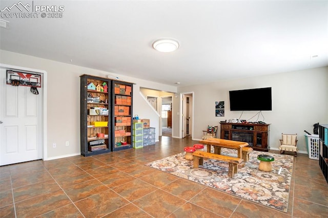 7544 Lake Ave, Fountain, CO 80817 - living room with baseboards and stairs