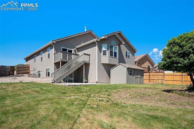 7544 Lake Ave, Fountain, CO 80817 - rear view of house with stairway, stucco siding, and a deck