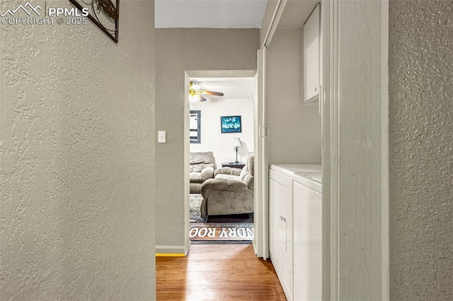269 Evergreen Rd, Woodland Park, CO 80863 - hallway with a textured wall, independent washer and dryer, and wood finished floors