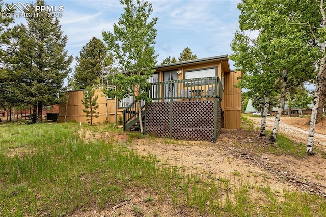 269 Evergreen Rd, Woodland Park, CO 80863 - rear view of house with a deck and stairway