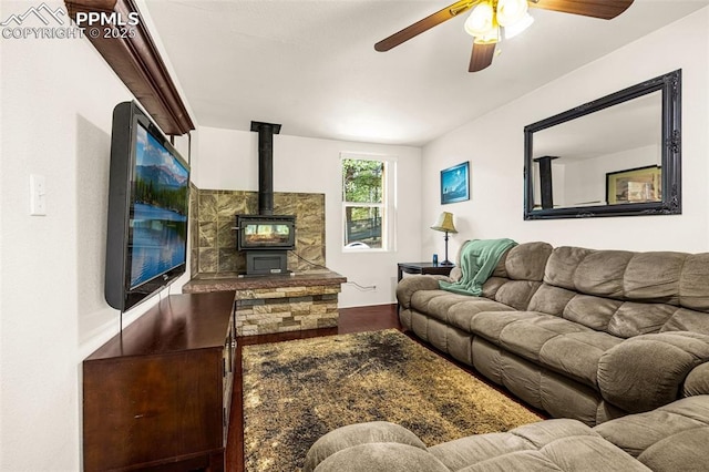 269 Evergreen Rd, Woodland Park, CO 80863 - living room featuring wood finished floors, a wood stove, and ceiling fan