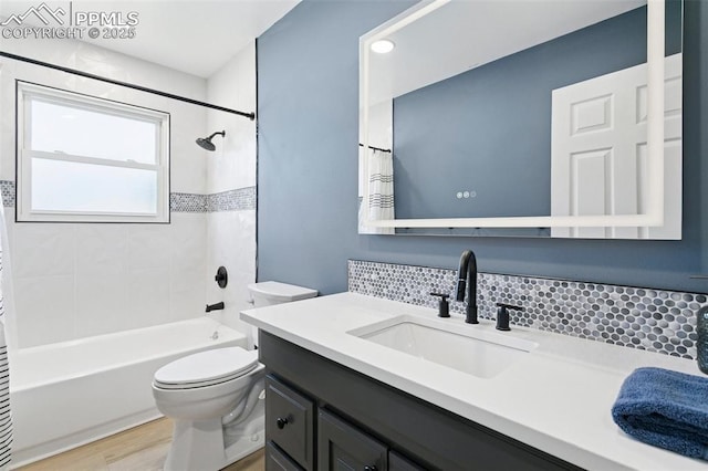 4603 Bella Dr, Colorado Springs, CO 80918 - bathroom featuring vanity, tasteful backsplash, shower / bath combo, and wood finished floors