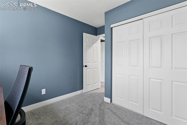 4603 Bella Dr, Colorado Springs, CO 80918 - unfurnished bedroom with carpet floors, a closet, and a textured ceiling