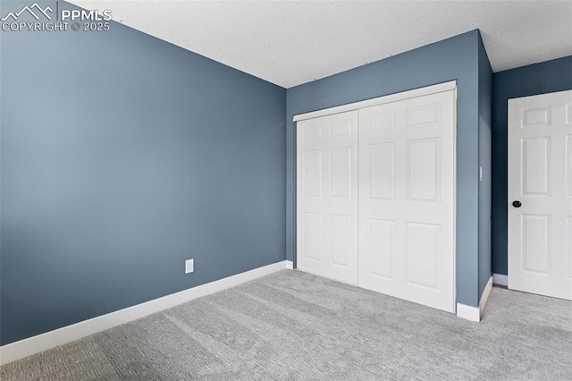 4603 Bella Dr, Colorado Springs, CO 80918 - unfurnished bedroom with carpet, a closet, and a textured ceiling