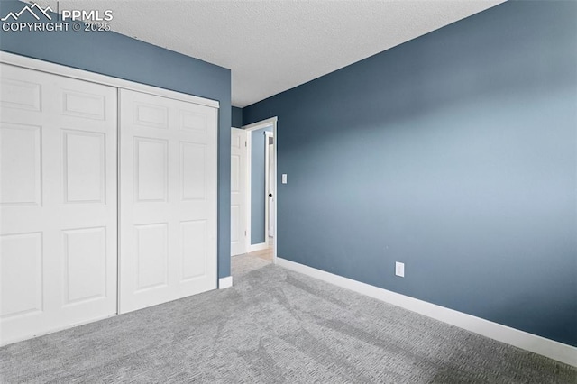4603 Bella Dr, Colorado Springs, CO 80918 - unfurnished bedroom with carpet, a closet, and a textured ceiling