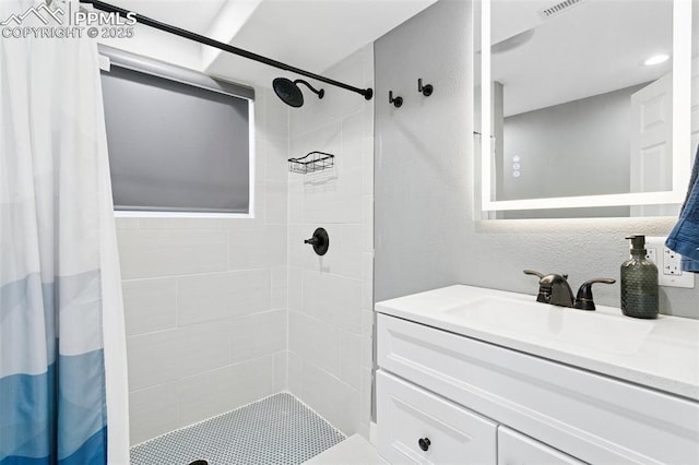 4603 Bella Dr, Colorado Springs, CO 80918 - full bathroom featuring tiled shower and vanity