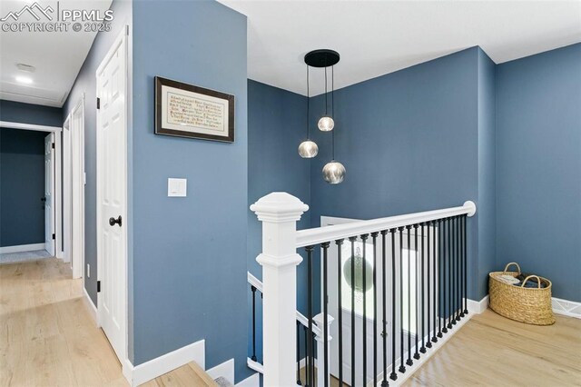 4603 Bella Dr, Colorado Springs, CO 80918 - hallway with an upstairs landing and wood finished floors