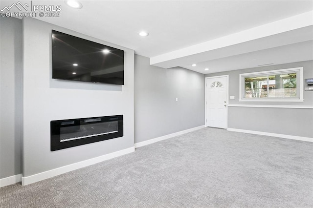 4603 Bella Dr, Colorado Springs, CO 80918 - unfurnished living room with carpet flooring, recessed lighting, and a glass covered fireplace