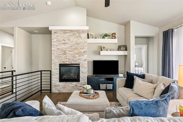 6792 David Anthony Ct, Colorado Springs, CO 80922 - living area featuring vaulted ceiling, wood finished floors, and a stone fireplace
