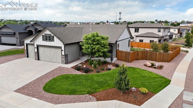 6792 David Anthony Ct, Colorado Springs, CO 80922 - view of front of property featuring concrete driveway, a residential view, board and batten siding, and stone siding