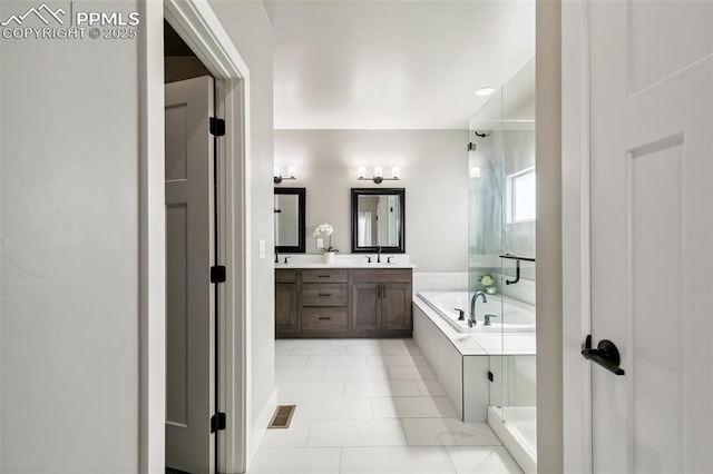 6792 David Anthony Ct, Colorado Springs, CO 80922 - full bathroom featuring double vanity, a bath, a shower with door, and tile patterned floors