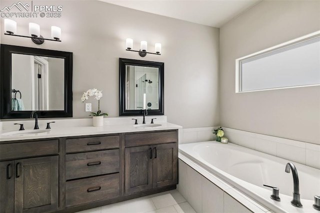 6792 David Anthony Ct, Colorado Springs, CO 80922 - bathroom with double vanity, a garden tub, and tile patterned flooring