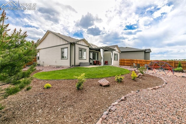 6792 David Anthony Ct, Colorado Springs, CO 80922 - rear view of property featuring board and batten siding, a patio, a fenced backyard, a pergola, and a playground
