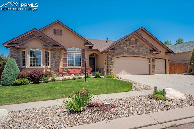 5763 Show Down Ln, Colorado Springs, CO 80923 - view of front of house with stone siding, stucco siding, and concrete driveway