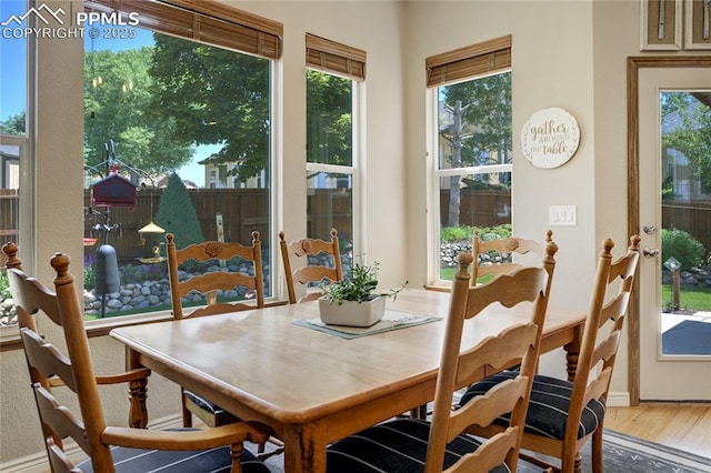5763 Show Down Ln, Colorado Springs, CO 80923 - dining space with healthy amount of natural light and wood finished floors