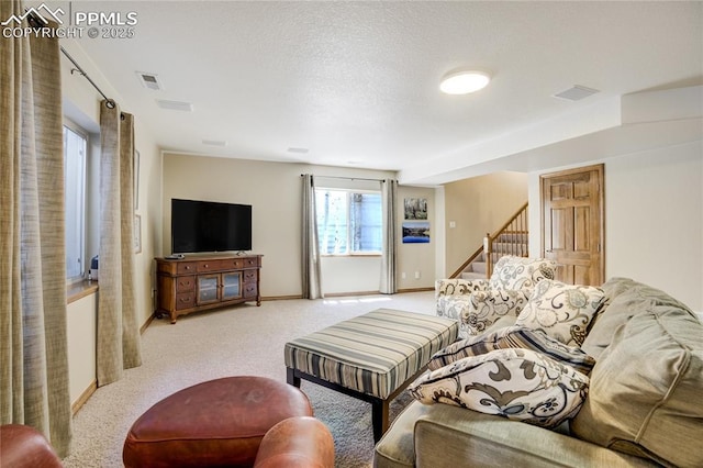 5763 Show Down Ln, Colorado Springs, CO 80923 - carpeted living room with stairway and baseboards