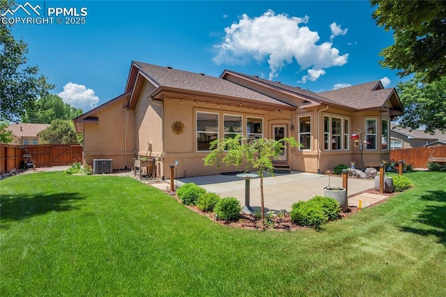 5763 Show Down Ln, Colorado Springs, CO 80923 - back of property featuring stucco siding, a fenced backyard, a patio, and roof with shingles