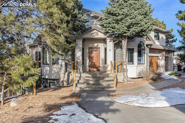 17870 New London Rd, Monument, CO 80132 - view of property hidden behind natural elements with stucco siding and stone siding