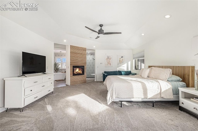 17870 New London Rd, Monument, CO 80132 - bedroom featuring light colored carpet, recessed lighting, a tray ceiling, a fireplace, and ceiling fan
