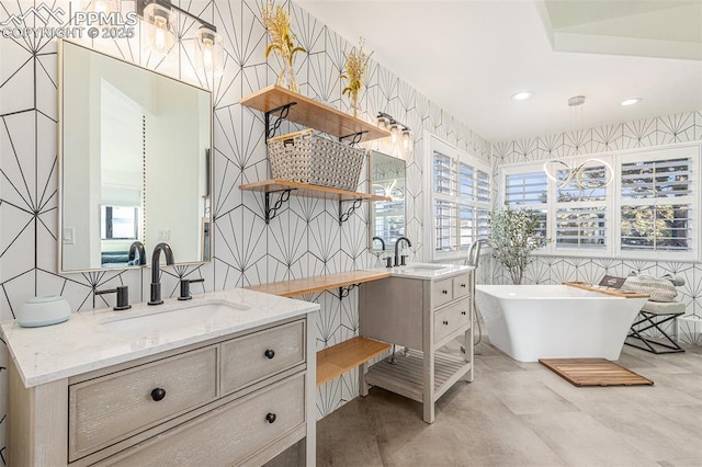 17870 New London Rd, Monument, CO 80132 - bathroom with two vanities, a freestanding tub, tile walls, recessed lighting, and wallpapered walls