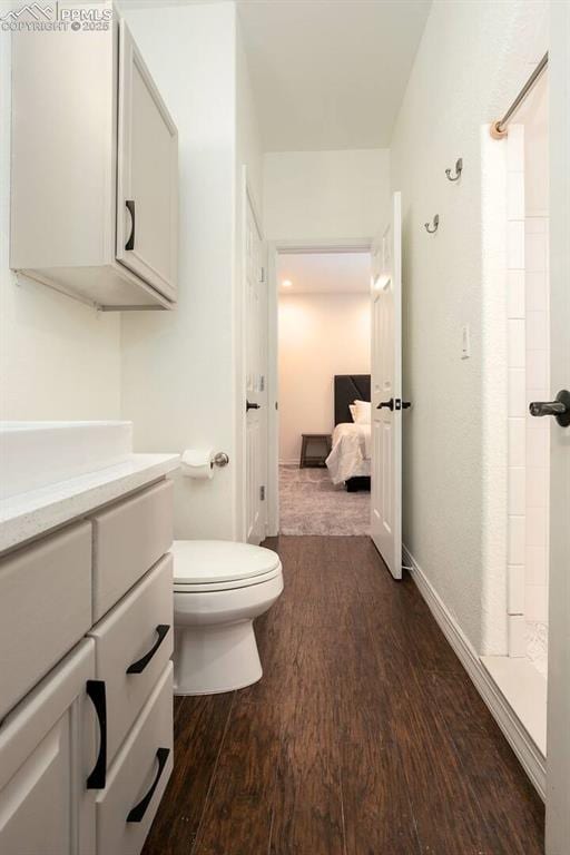 17870 New London Rd, Monument, CO 80132 - full bathroom featuring wood finished floors, vanity, and a shower