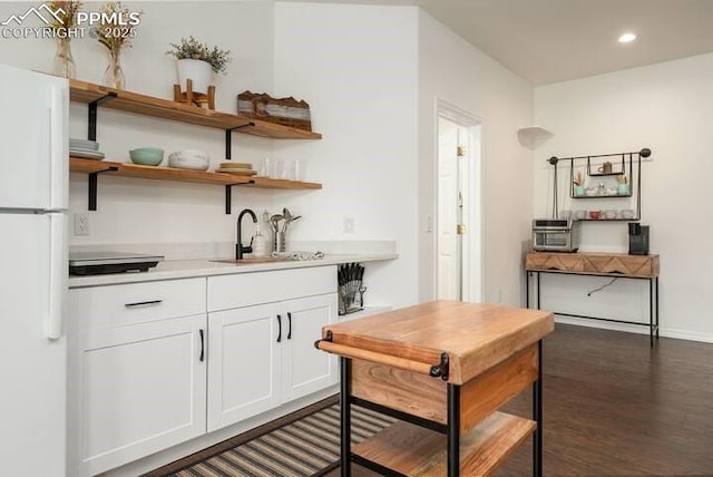 17870 New London Rd, Monument, CO 80132 - indoor wet bar with freestanding refrigerator, dark wood-style flooring, and recessed lighting
